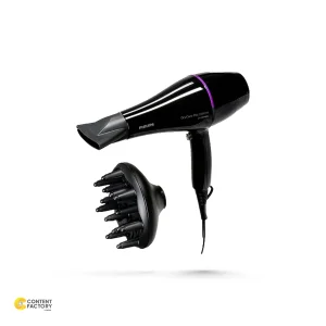 سشوار حرفه‌ای 2200 وات فیلیپس مدل BHD274، موتور AC، وزن 600 گرم، دارای سری متمرکز‌کننده باریک، متمرکز‌کننده پهن با ویژگی حجم‌دهندگی، با قابلیت باد سرد، فناوری تولید یون