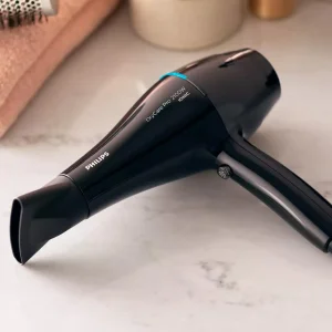 سشوار حرفه‌ای 2100 وات فیلیپس مدل BHD272، موتور AC، وزن 790 گرم، دارای سری متمرکز‌کننده باریک، با قابلیت باد سرد، فناوری تولید یون