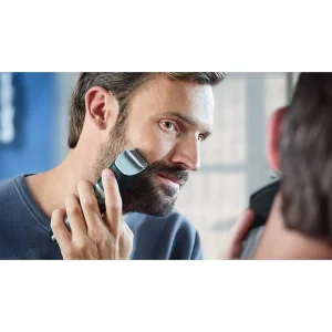 ماشین اصلاح موی صورت فیلیپس مدل BT9810/13 با تیغه استیل ضدزنگ، فناوری PowerAdapt Sensor، استفاده خشک و مرطوب، ضد آب، شانه فلزی قابل تنظیم، باتری لیتیوم یونی با شارژ سریع 60 دقیقه و زمان استفاده 120 دقیقه، طراحی ارگونومیک و منبع انرژی برق و باتری