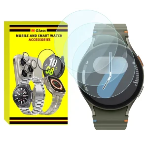 محافظ صفحه نمایش شیشه‌ای ام‌گلس مدل Glass-MG مناسب برای ساعت هوشمند سامسونگ Galaxy Watch 7 44mm بسته سه عددی