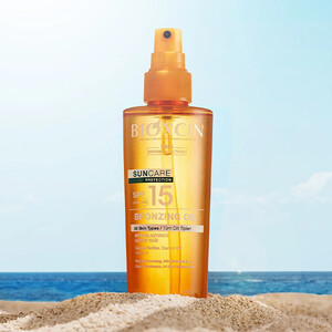 روغن ضد آفتاب و برنزه کننده بیوکسین مدل SUNCARE PROTECTION با SPF15 مناسب انواع پوست حجم ۲۰۰ میل