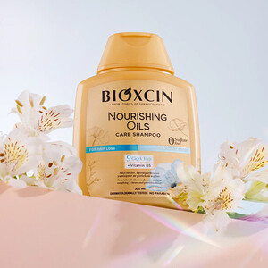 شامپو ضدریزش بیوکسین مدل Nourishing Oils با خاصیت مغذی و ترمیم‌کننده فاقد سولفات مناسب موهای خشک و آسیب‌دیده حجم 300ml