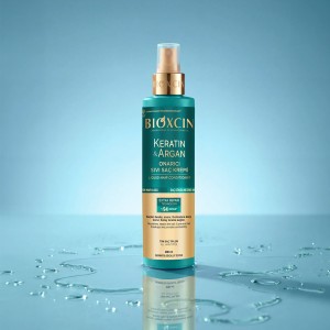 اسپری ترمیم‌کننده مو بیوکسین مدل KERATIN & ARGAN با تکنولوژی EXTRA REPAIR حاوی آمینواسید حجم ۱۵۰ میل