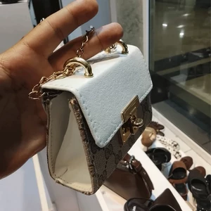 کیف دستی زنانه طرح گوچی دو رنگ با قفل چرخشی فلزی