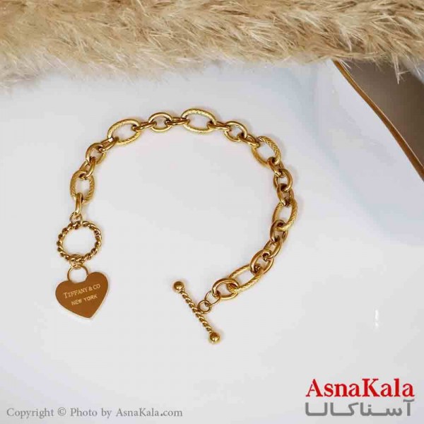 دستبند تیفانی اند کو زنانه مدل قلب با قفل T استیل طلایی کد DSB18368W