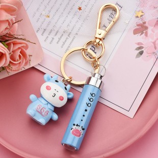 جاسوئیچی طرح گاو همراه با چراغ قوه جیبی Cute cow with mini flashlight keychain