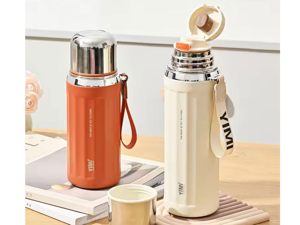 فلاسک استیل حجم 630 میلی لیتر بدنه شیار دار به همراه بند دستی YIMI