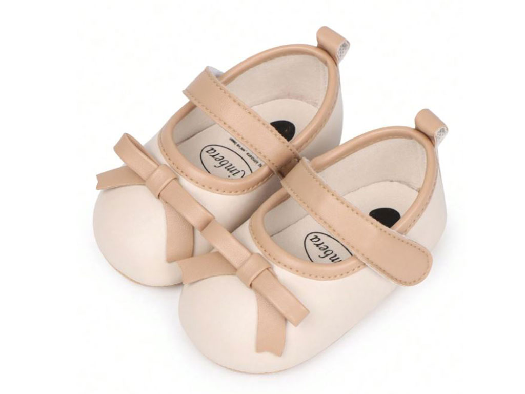 پاپوش استپ دار نوزادی دخترانه رنگ کرم نسکافه ای طرح پاپیون