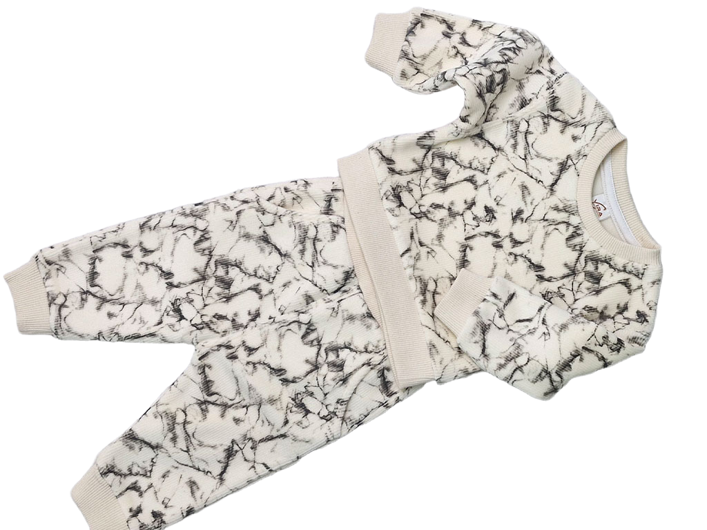 ست بلوز و شلوار مخمل  شیری  طرح ابرو بادی مشکی  نیوبرن