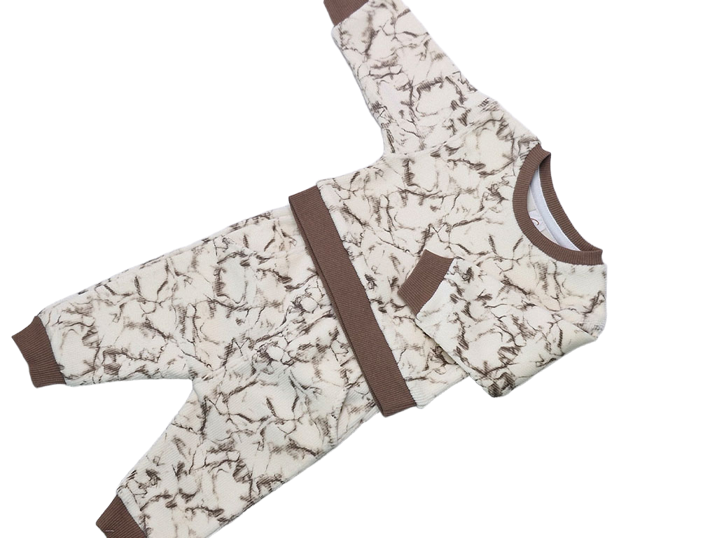 ست بلوز و شلوار مخمل  شیری  طرح ابرو بادی نسکافه ای نیوبرن