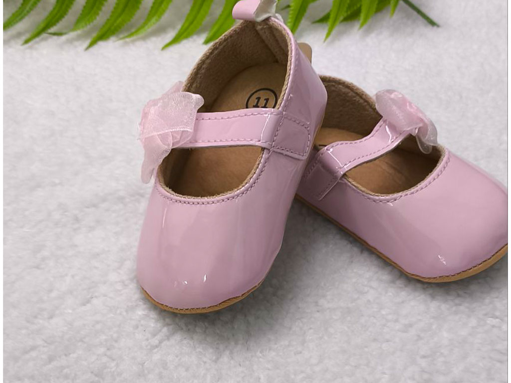 پاپوش صورتی رنگ استپ دار نوزادی دخترانه طرح پاپیون توری