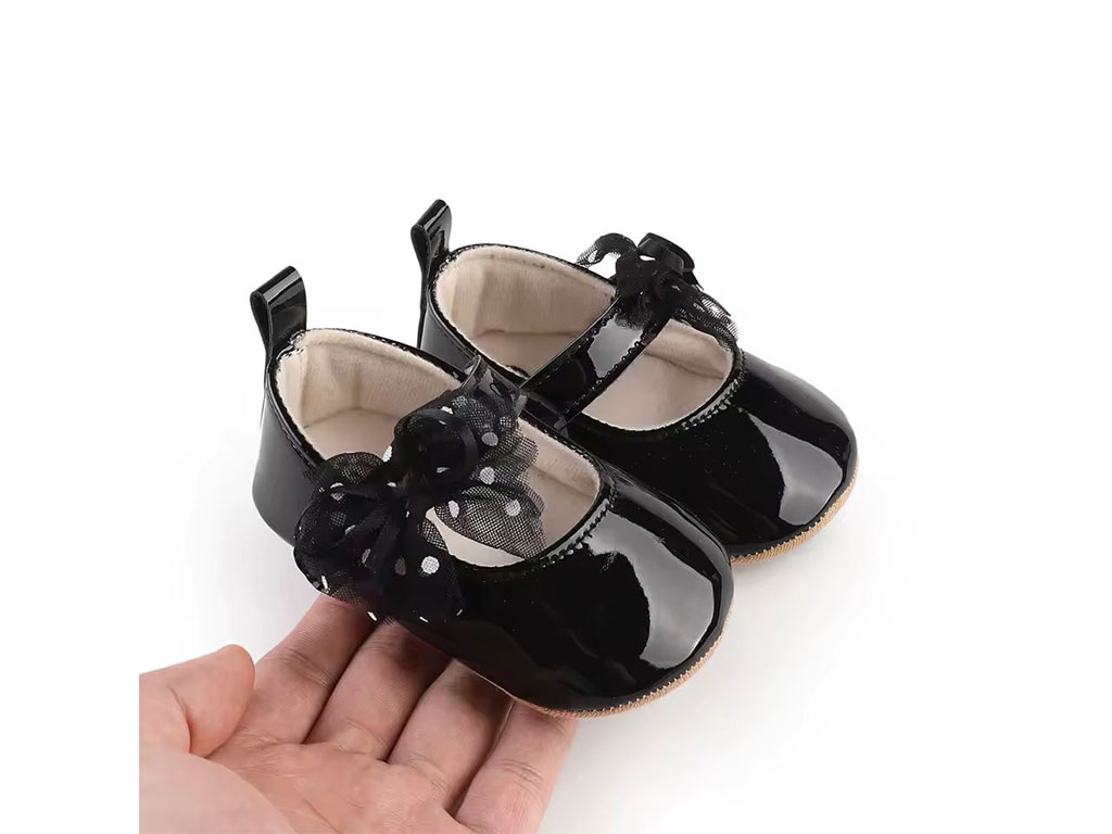 پاپوش نوزادی دخترانه مشکی ورنی پاپیون توردار خال خالی