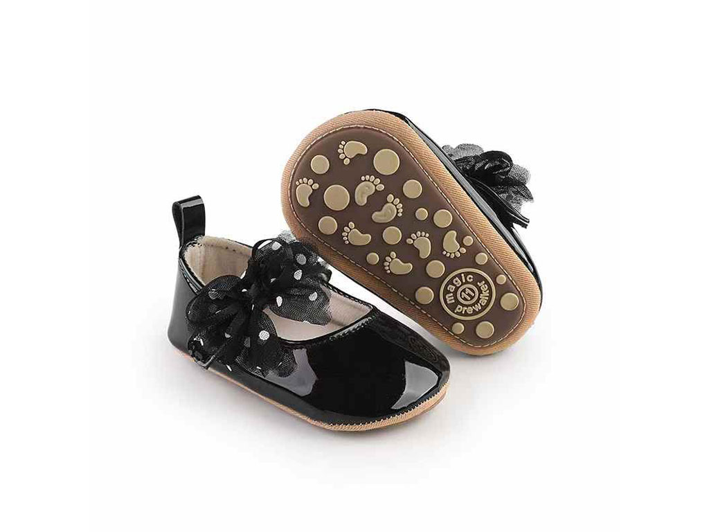 پاپوش نوزادی دخترانه مشکی ورنی پاپیون توردار خال خالی