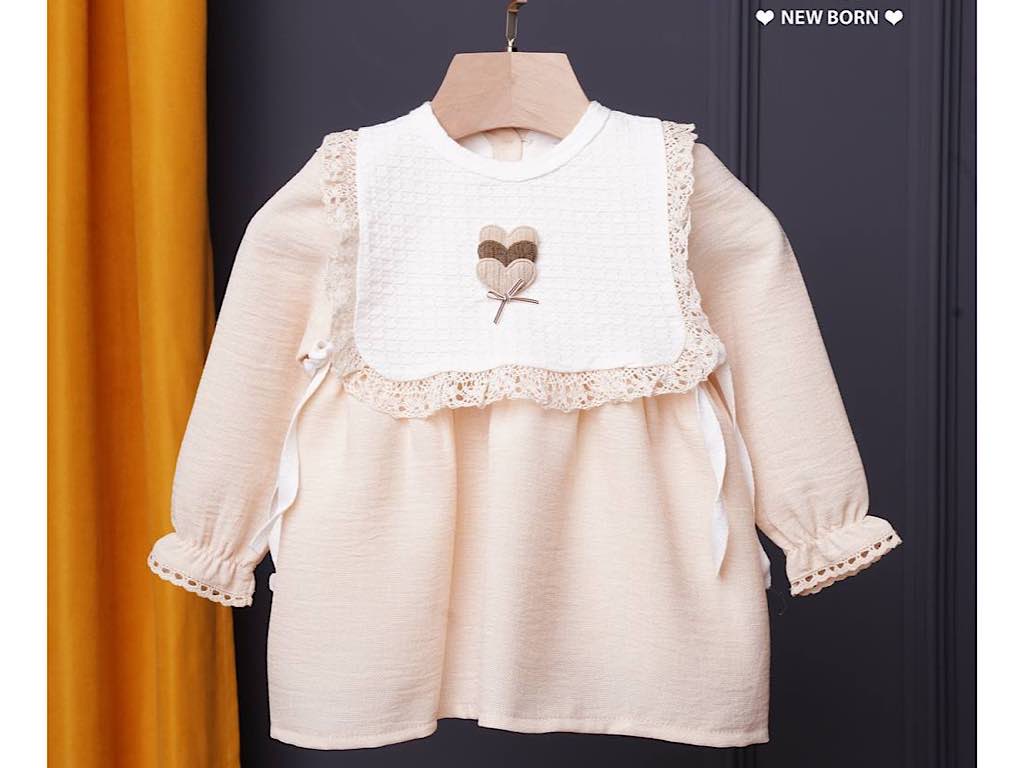 پیراهن دخترانه کرم رنگ جلو پیشبند دار  نیوبرن New Born