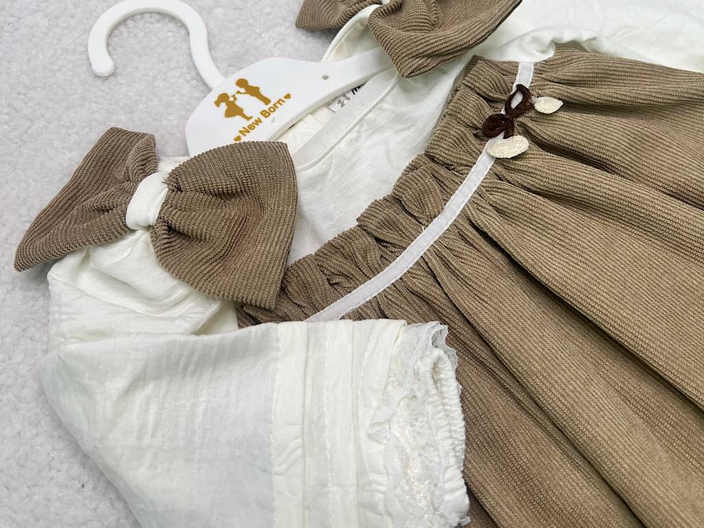 پیراهن دخترانه مخمل نسکافه ای  جلو سینه پلیسه پاپیون دار نیوبرن New Born