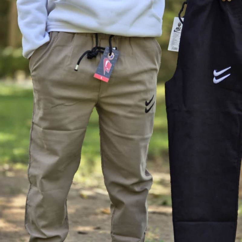 آفر ویژه شلوار اسلش مردانه پسرانه طرح نایک تن خور عالی و زیبا رنگ کرمی با ارسال رایگان