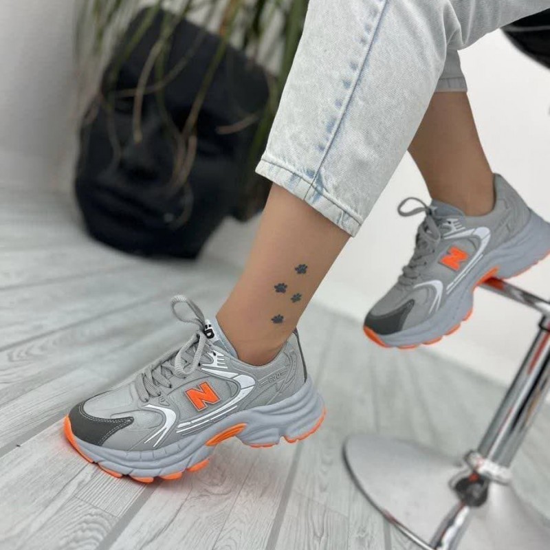 حراج ویژه کفش اسپرت زنانه دخترانه مدل نیوبالانس خاص و دلبر  رنگ طوسی نارنجی  با ارسال رایگان