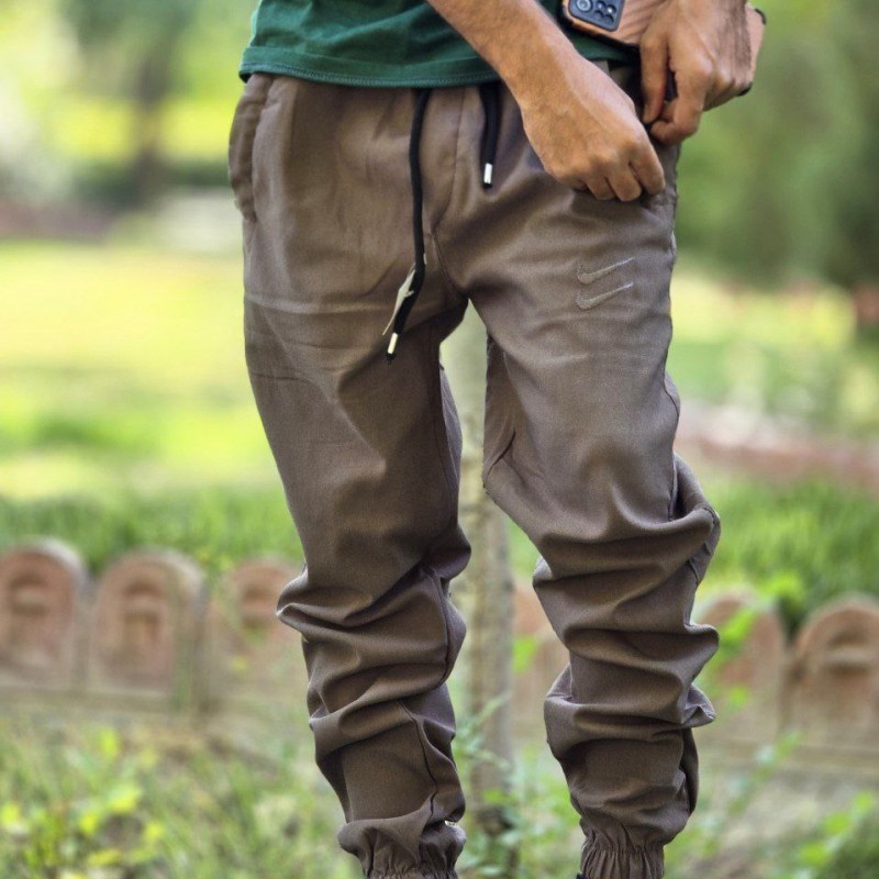 فروش  شلوار اسلش نایک مردانه پسرانه جیب زیپ دار  جذاب و راحت رنگ خاکی  با ارسال رایگان