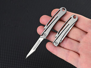 کیفیت چاقوی آنباکسینگ تیتانیومی تاشو دارای دو نوع تیغه قابل تعویض Replaceable Blade Unboxing Knife