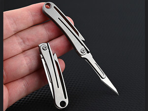 فروش چاقوی آنباکسینگ تیتانیومی تاشو دارای دو نوع تیغه قابل تعویض Replaceable Blade Unboxing Knife