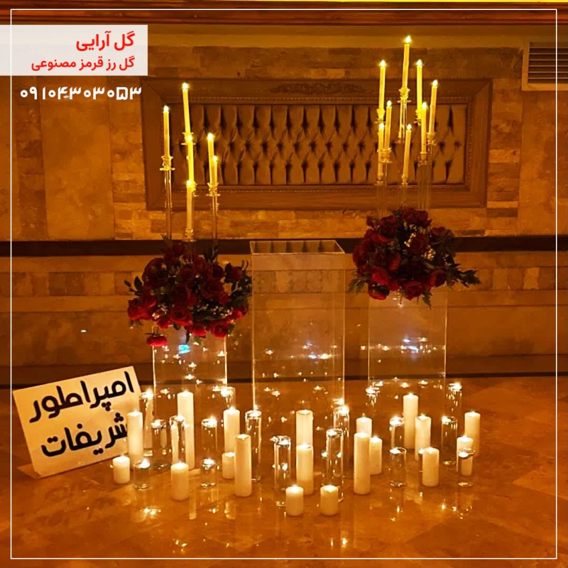 گل آرایی گل رز قرمز مصنوعی همراه با شمع ارایی