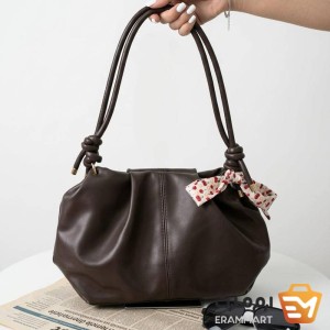 خرید کیف چروک Coach رنگ قهوه‌ای و کرم
