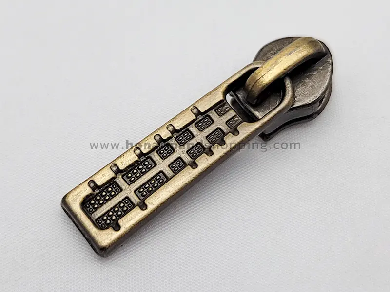 سرزیپ طرح کامپیوتری شماره 3 مناسب زیپ دندانه پلاستیکی رنگ زردقلم