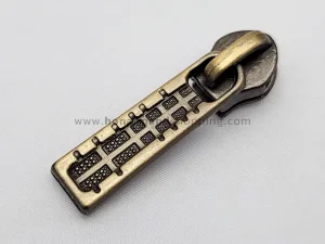 سرزیپ طرح کامپیوتری شماره 3 مناسب زیپ دندانه پلاستیکی رنگ زردقلم