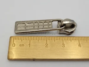 سرزیپ طرح کامپیوتری شماره 5 مناسب زیپ دندانه پلاستیکی رنگ نیکل