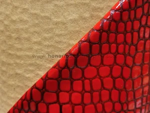 چرم مصنوعی ورنی طرح سنگی رنگ قرمز (ابعاد 100x140 سانت)