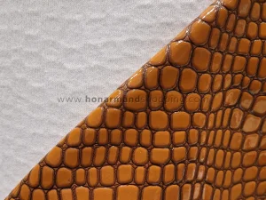 چرم مصنوعی ورنی طرح سنگی رنگ عسلی (ابعاد 100x140 سانت)