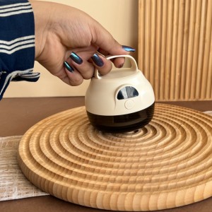 پرز گیر لباس شارژی دو حالته دسته دار طرح گرد