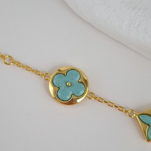 دستبند طلایی و فیروزه‌ای