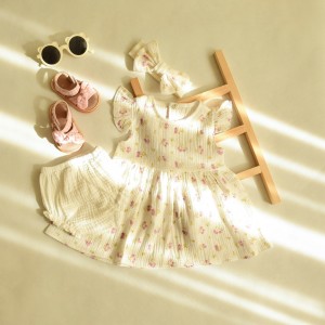 سِت سه تیکه نوزادی موسیلین(  پیراهن ، شورت و هدبند )