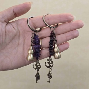 جاکلیدی سنگی با نماد کدو قلیانی برنجی و اوم و قفل و کلید