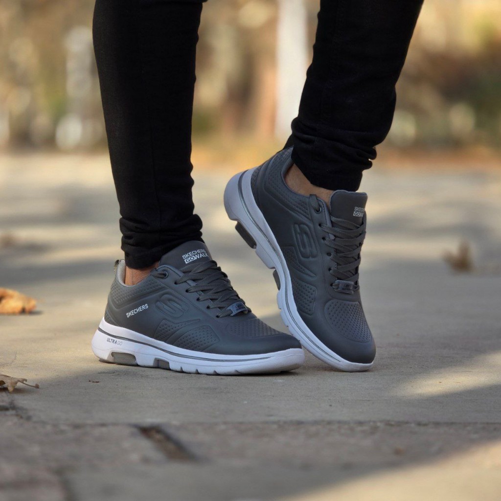 حراج واقعی کفش کتونی اسپرت مردانه و پسرانه مدل اسکیچرز رنگ طوسی تیره جذاب ومناسب افراد خاص با ارسال رایگان