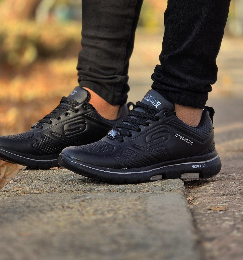 حراج واقعی کفش کتونی اسپرت مردانه و پسرانه مدل اسکیچرز رنگ طوسی تیره جذاب ومناسب افراد خاص با ارسال رایگان