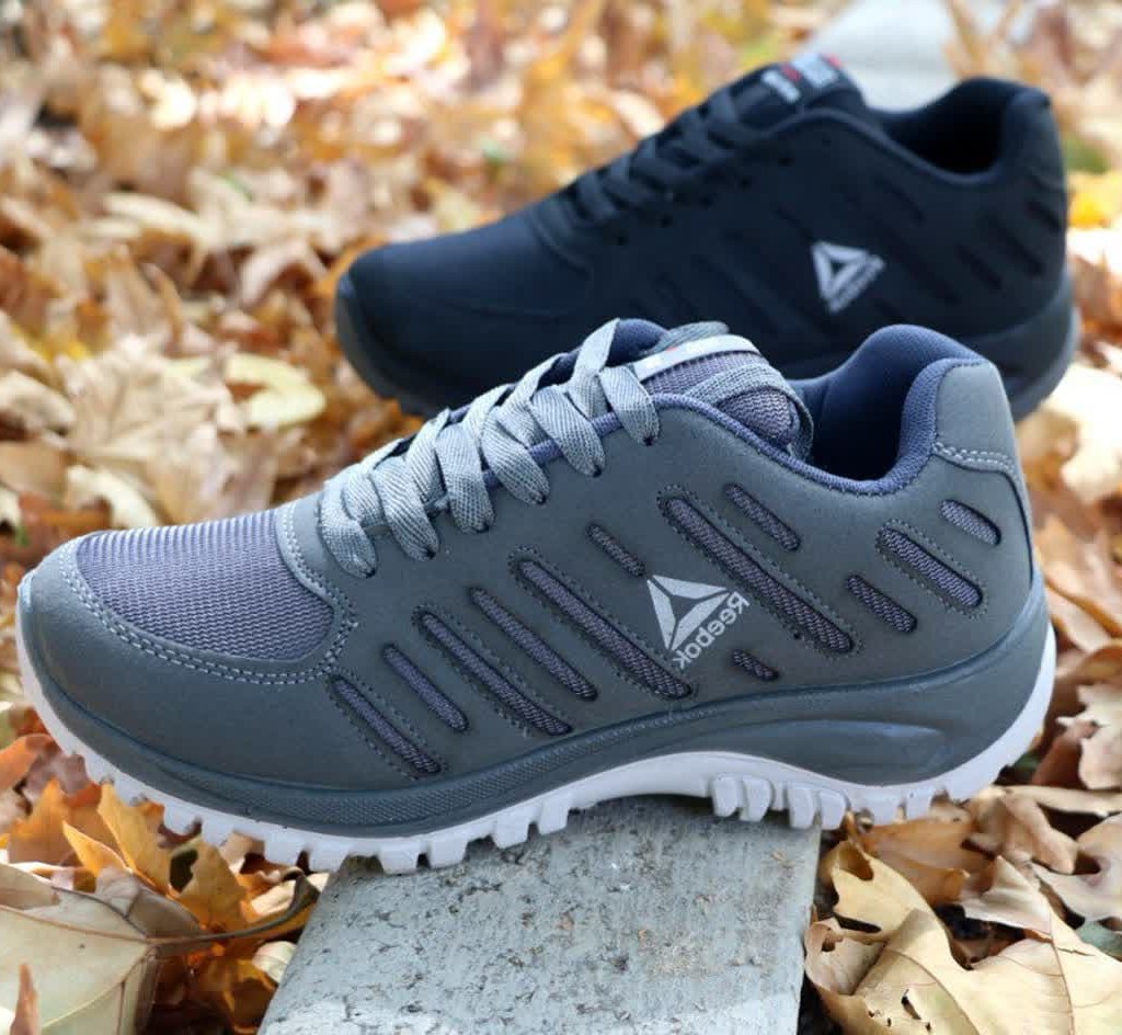 حرااا ج استثنایی کفش  اسپرت مردانه پسرانه مدل ریبوک زیره  پیو تزریق جنس فوق العاده عالی   سورمه ای با ارسال رایگان