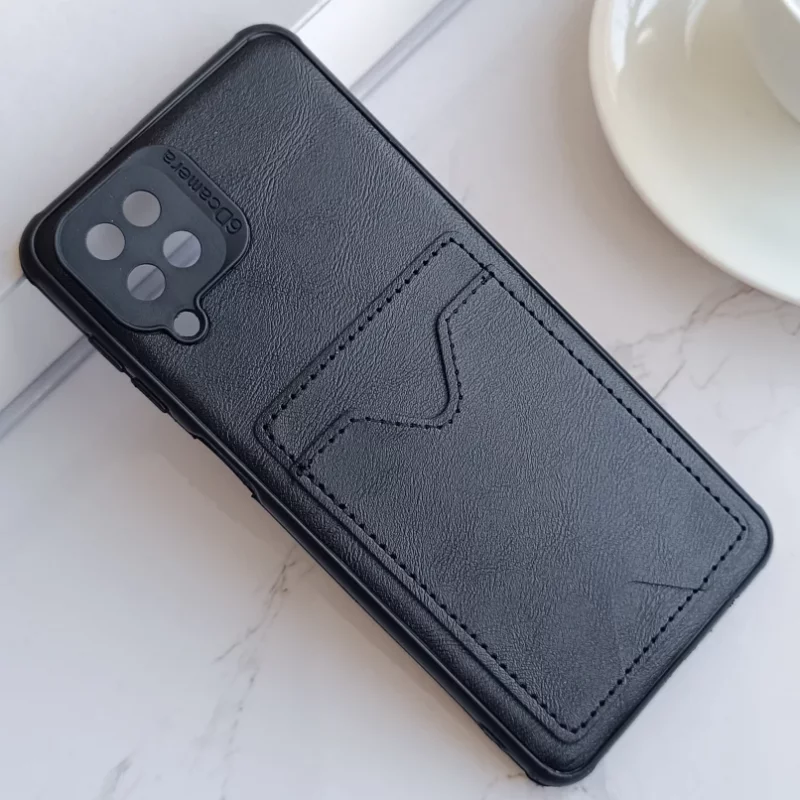 قاب جاکارتی دار Samsung Galaxy A12/ M12 مدل محافظ لنز دار با چرم دوخت دار - رنگ مشکی