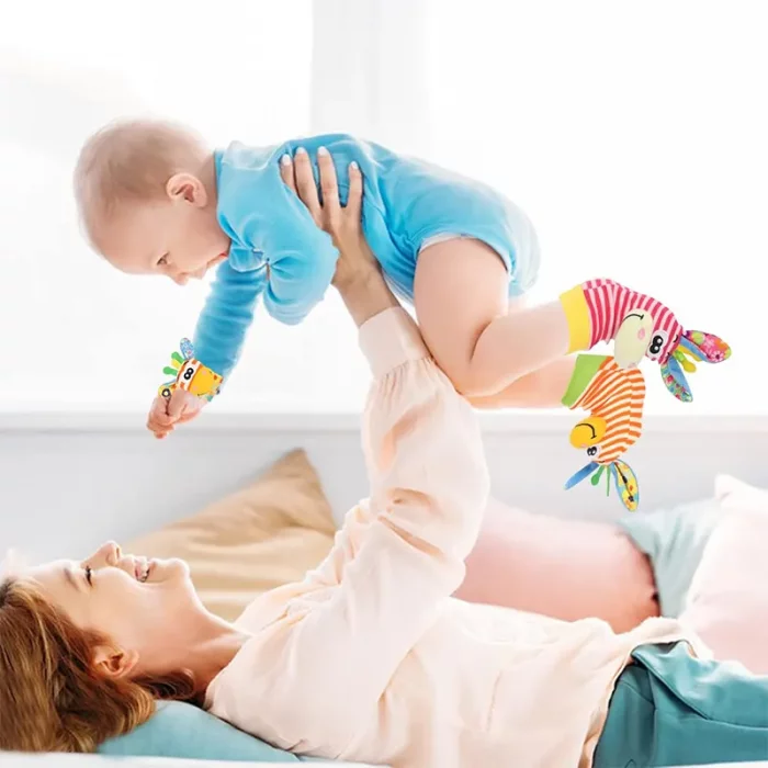 جوراب و مچ بند جغجغه ای کودک طرح حیوانات صورتی نارنجی کد 6753961