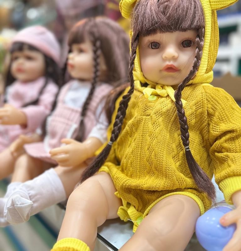 عروسک نوزادی سیلیکونی مدل Fashion Doll - لباس زرد شیک با چهره متفاوت