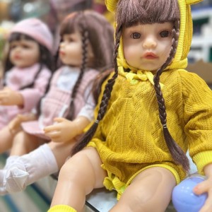 عروسک نوزادی سیلیکونی مدل Fashion Doll - لباس زرد شیک با چهره متفاوت