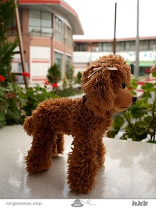 عروسک سگ چهار دست و پا A four-legged dog doll