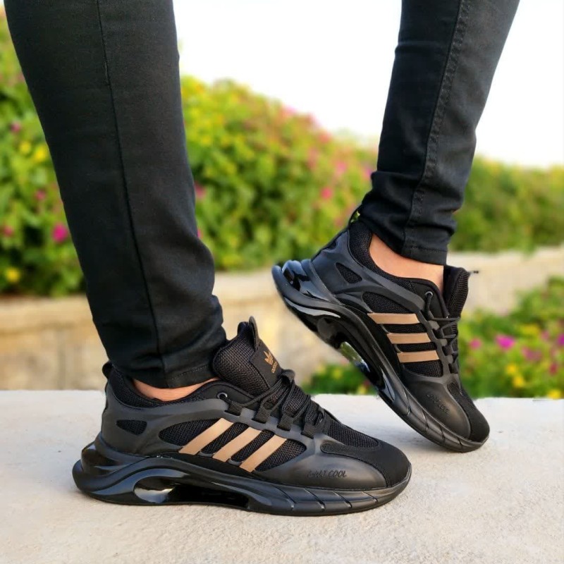 حراج باورنکردنی کفش کتونی اسپرت مردانه و پسرانه ادیداس کپسولی  زیره راحت و سبک رنگ مشکی تمام خط طلایی بااراسال رایگان3482