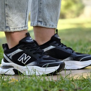 حراجی کفش کتونی اسپرت دخترانه و زنانه مدل نیوبالانس  طرح کپسولی بی نظیر رنگ مشکی سفید با ارسال رایگان