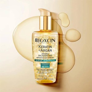 روغن ترمیم‌کننده و تقویت‌کننده مو بیوکسین مدل KERATIN & ARGAN با تکنولوژی EXTRA REPAIR حاوی آمینواسید حجم ۱۵۰ میل