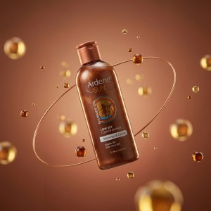 روغن آفتاب حاوی اکلیل آردن مدل Shimmer Oil با رنگ برنز مسی، تسریع برنزه‌شدن و شاین درخشان حجم ۲۵۰ میل