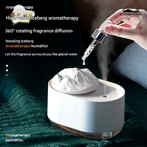 بهترین دستگاه رطوبت ساز و آروماتراپی شارژی طرح کوه یخ چرخان