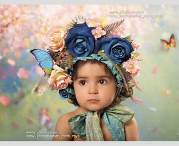 عکس کودک با تم کلاه گل آبی